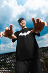 oversized-t-shirt-mockup-of-a-man-trying-to-do-a-frame-pose-on-a-rooftop-m57621